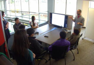 Meeting with students about ProQuest products and their school research projects.